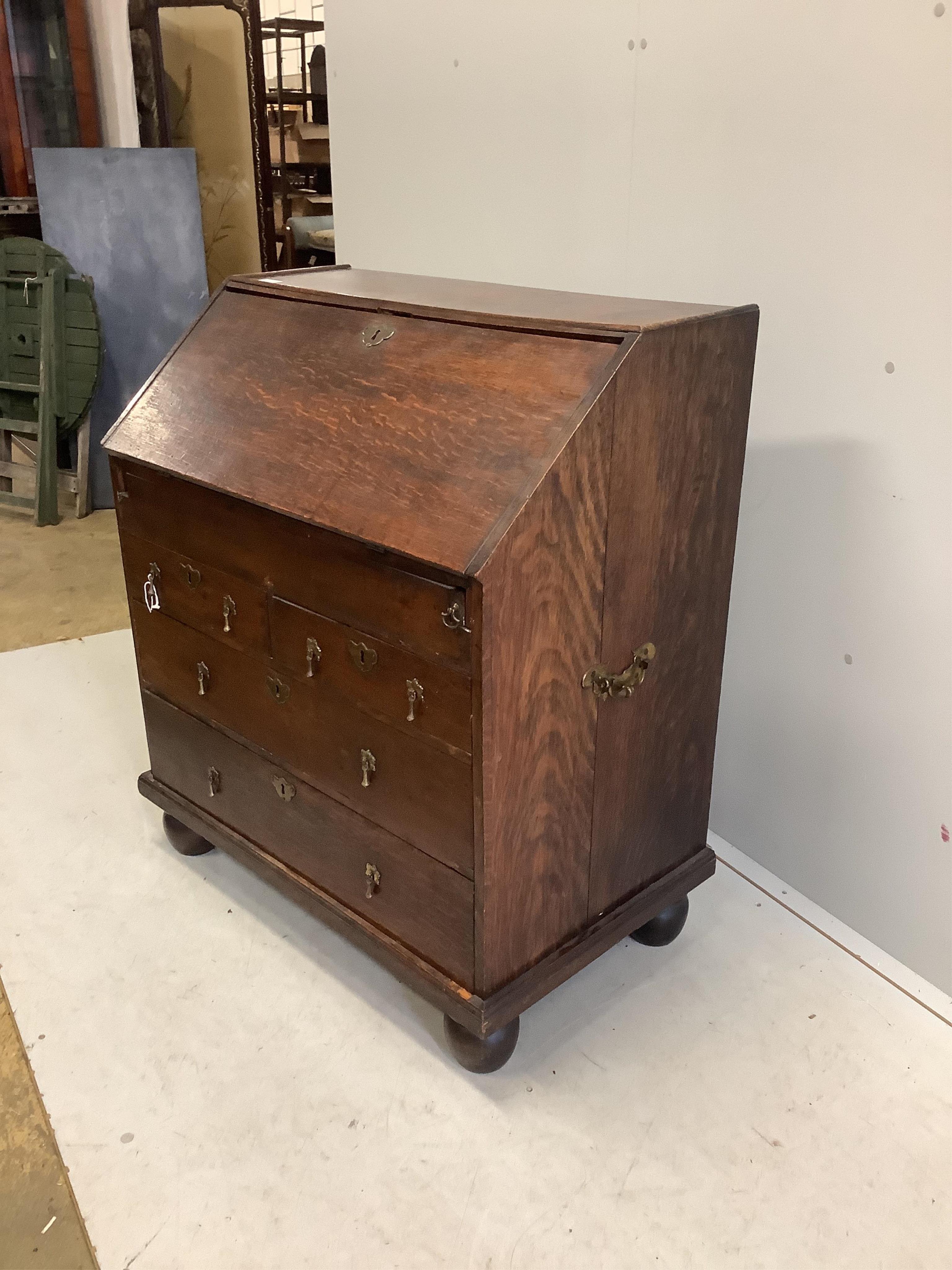 An 18th century oak bureau, width 84cm, depth 52cm, height 98cm. Condition - poor to fair